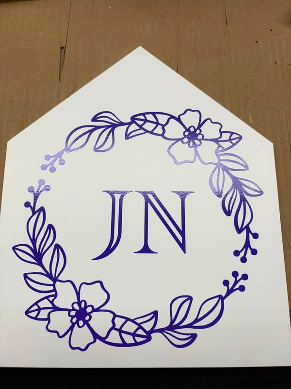 Custom JN monogram framed inside a purple floral wreath