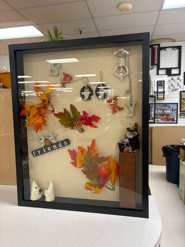 Shadow box of pressed autumn leaves, jewelry and keepsake charms