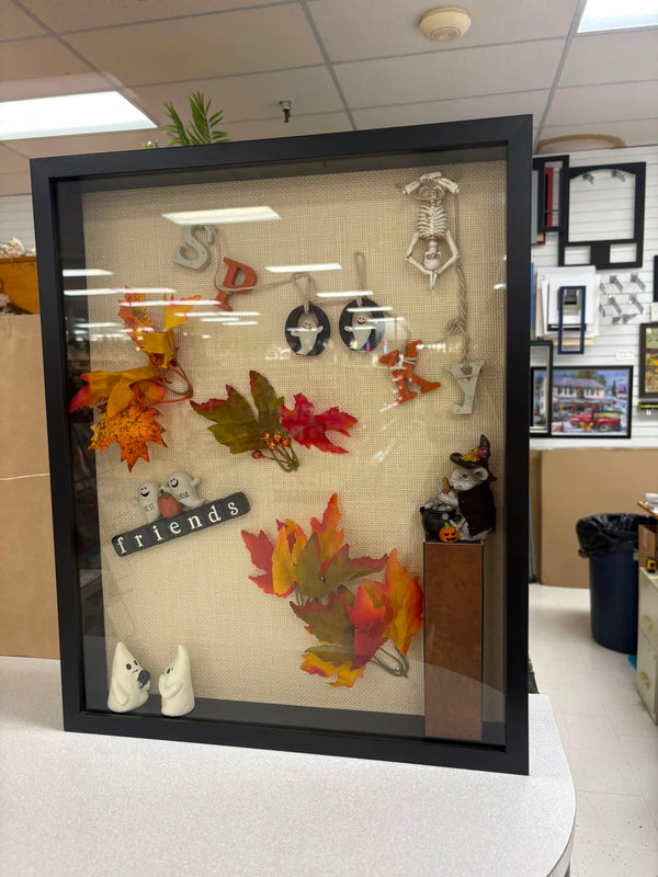 Shadow box of pressed autumn leaves, jewelry and keepsake charms