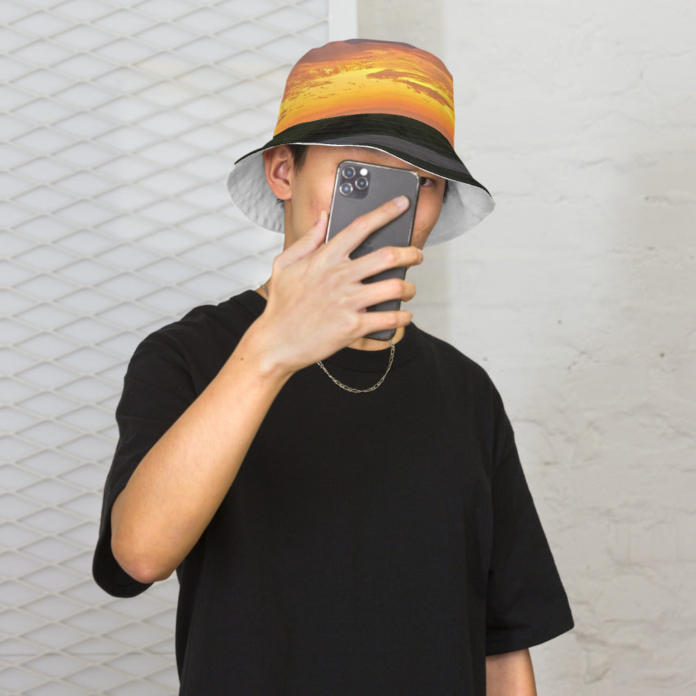 Photo Reversible Bucket Hat worn with an Iowa sunset photo printed on it