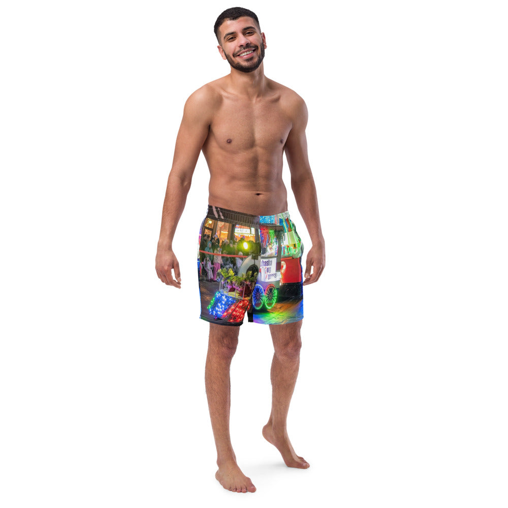 Front view of custom swim trunks printed all over with a customer photo