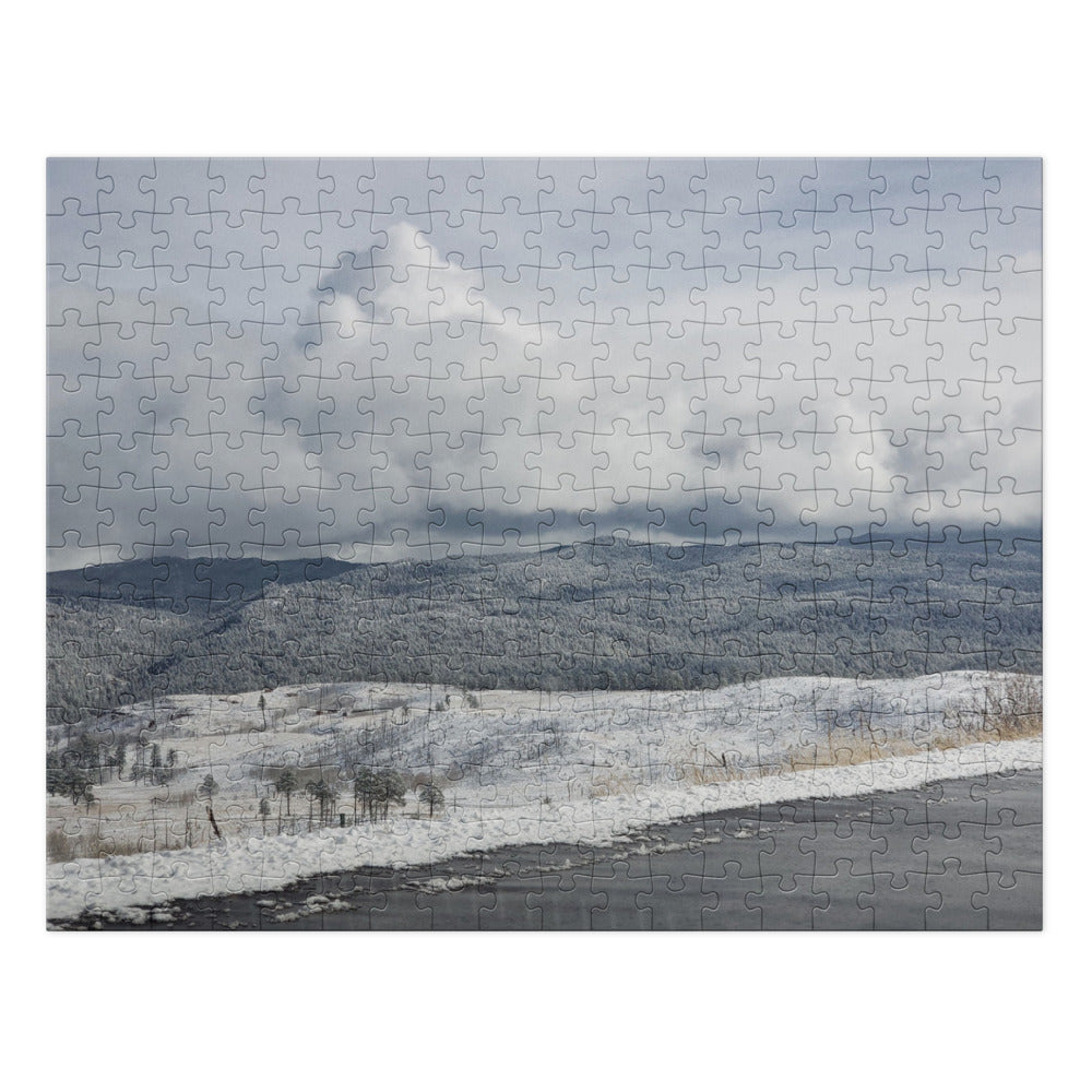 Jigsaw Puzzle with Tin shown with a photo of snowy hills printed on it