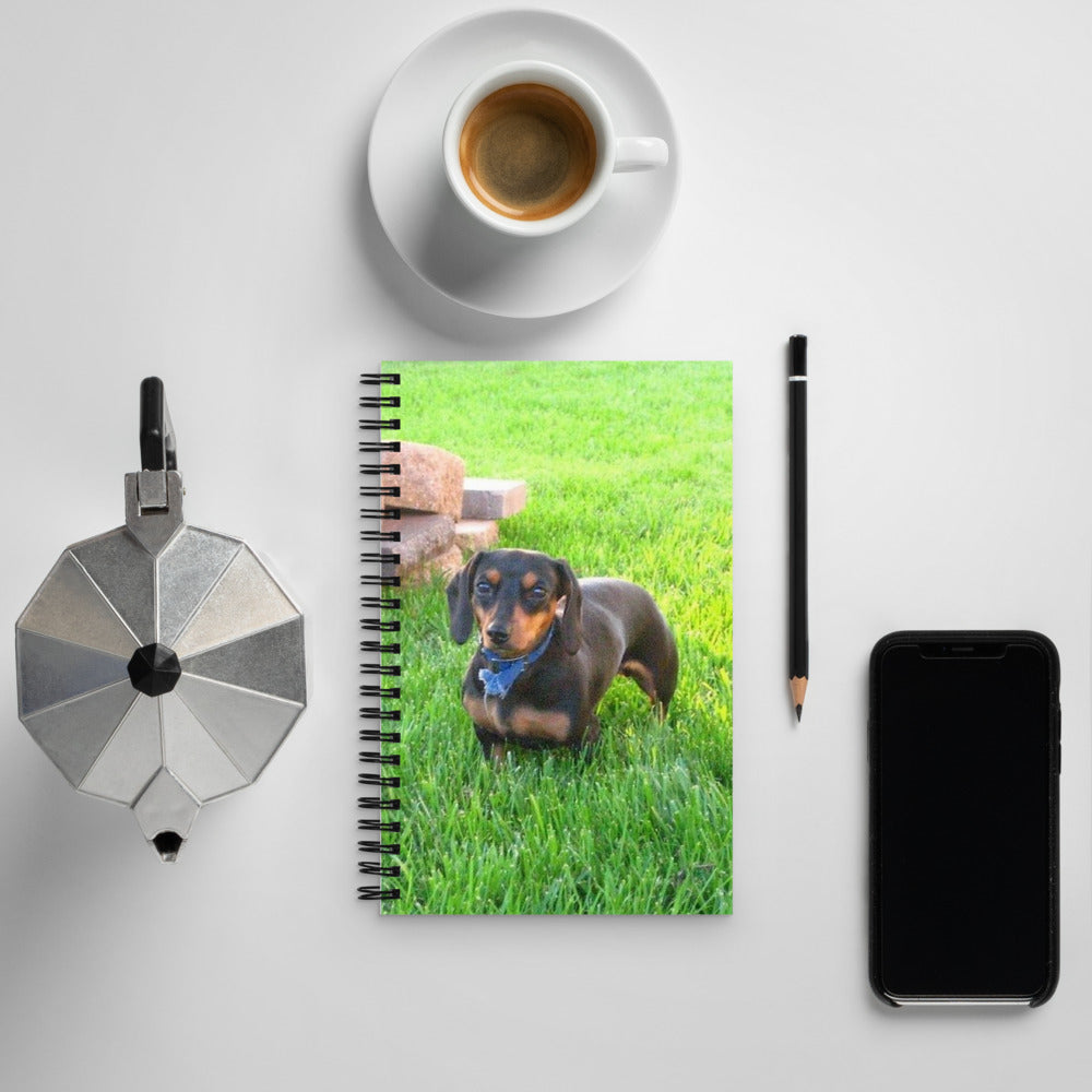Spiral Notebook shown with a photo of a dachshund in the grass printed on it