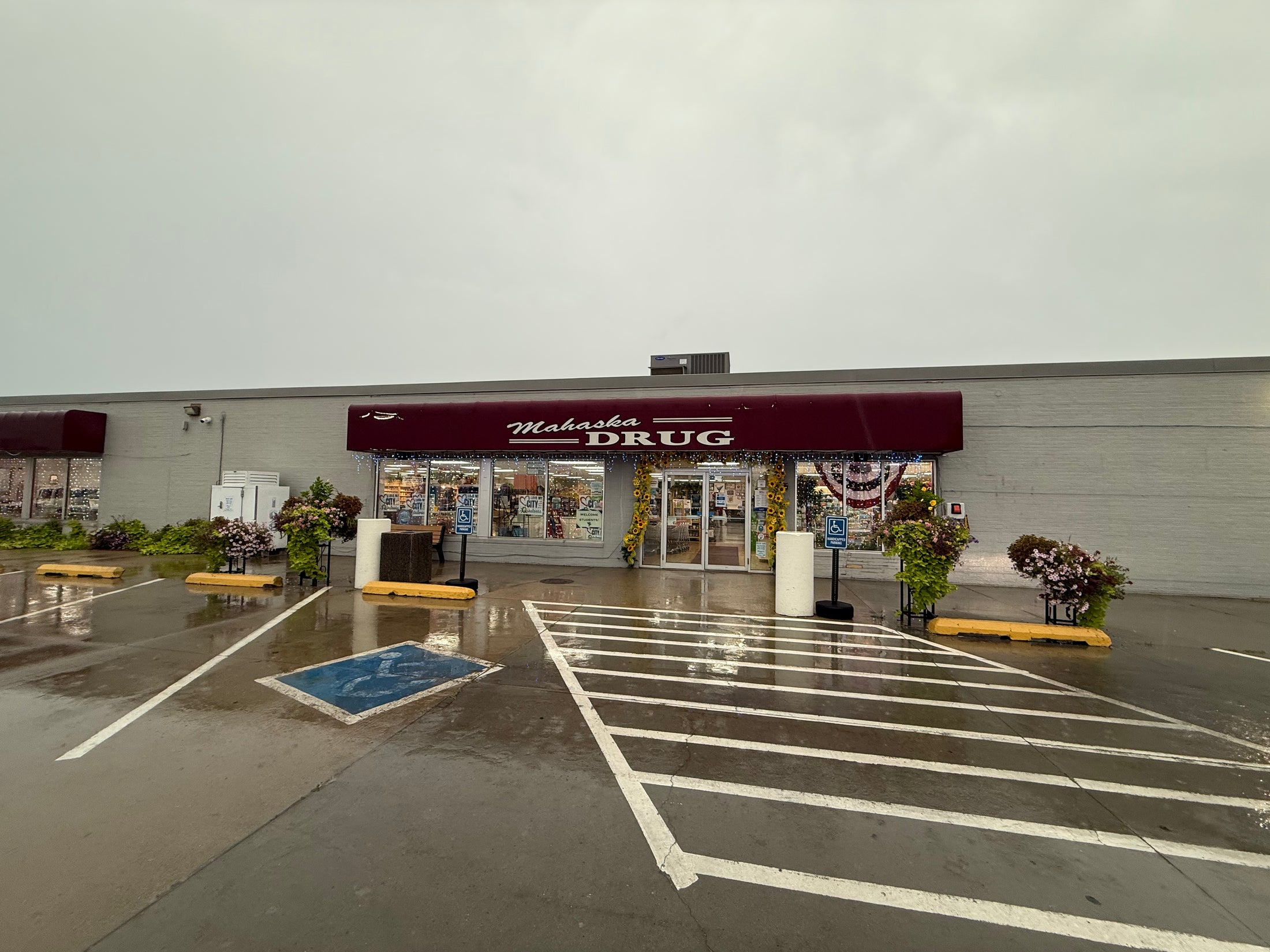 Mahaska Drug storefront and parking lot at 205 N E St., Oskaloosa, Iowa