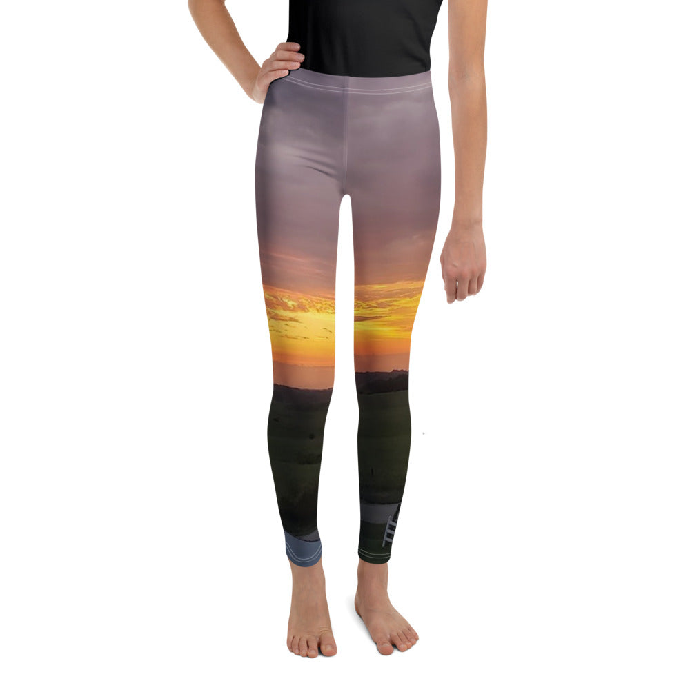 Photo Youth Leggings worn with an Iowa sunset photo printed on it