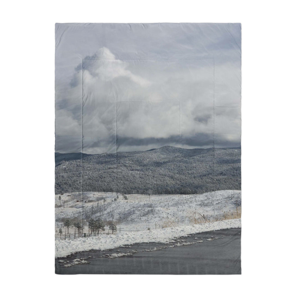 Comforter shown with a photo of snowy hills printed on it