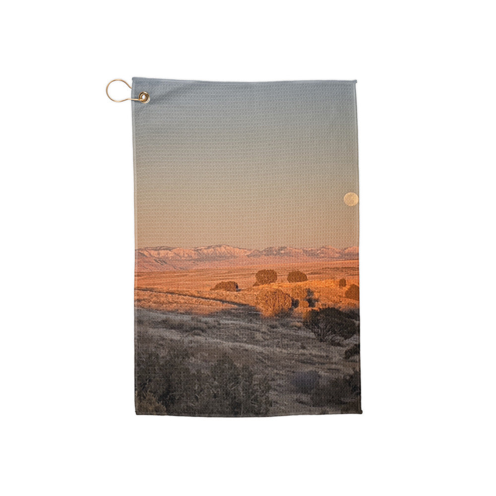 Golf Towel shown with a photo of the moon rising over fields printed on it