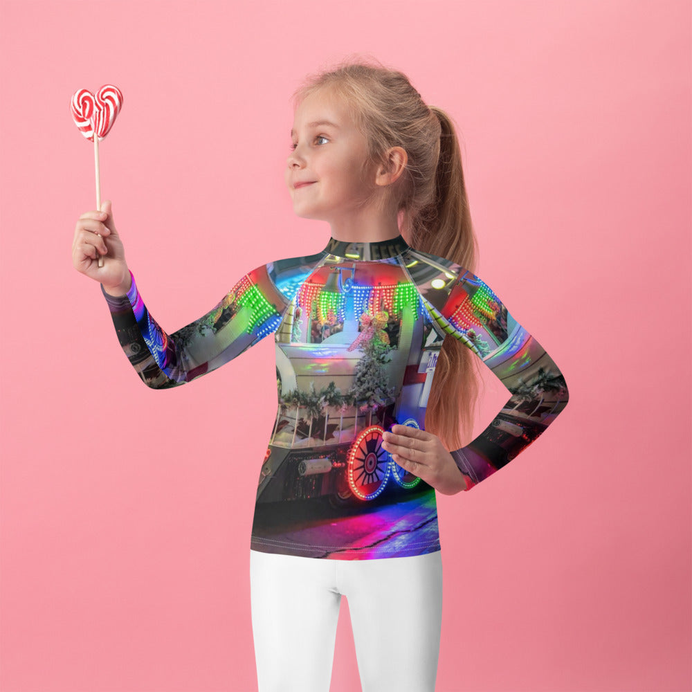 Front of a kids long-sleeve rash guard with a customer photo printed all over