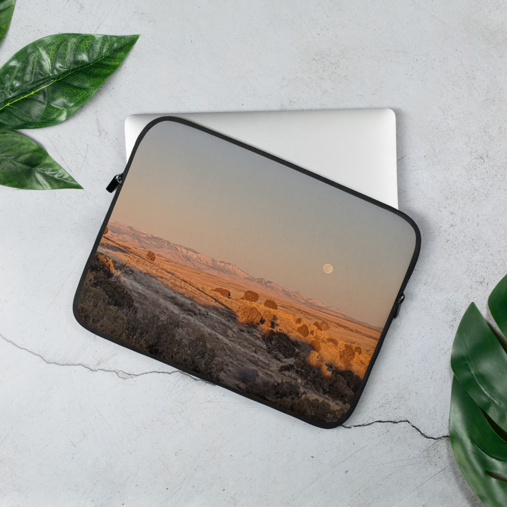 Laptop Sleeve shown with a photo of the moon rising over fields printed on it