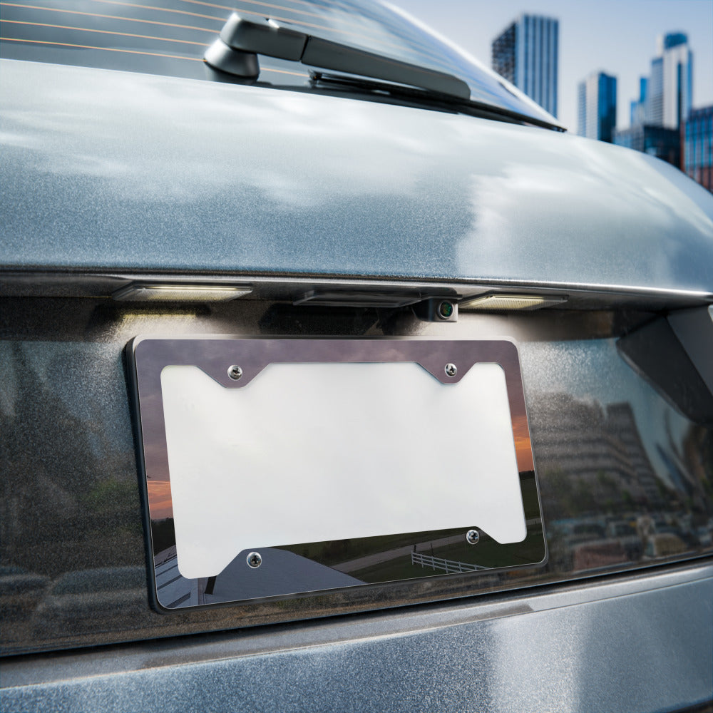 Metal License Plate Frame shown with an Iowa sunset photo printed on it