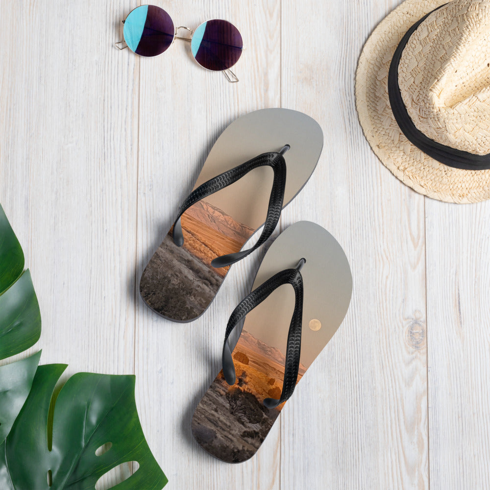 Flip Flops shown with a photo of the moon rising over fields printed on it